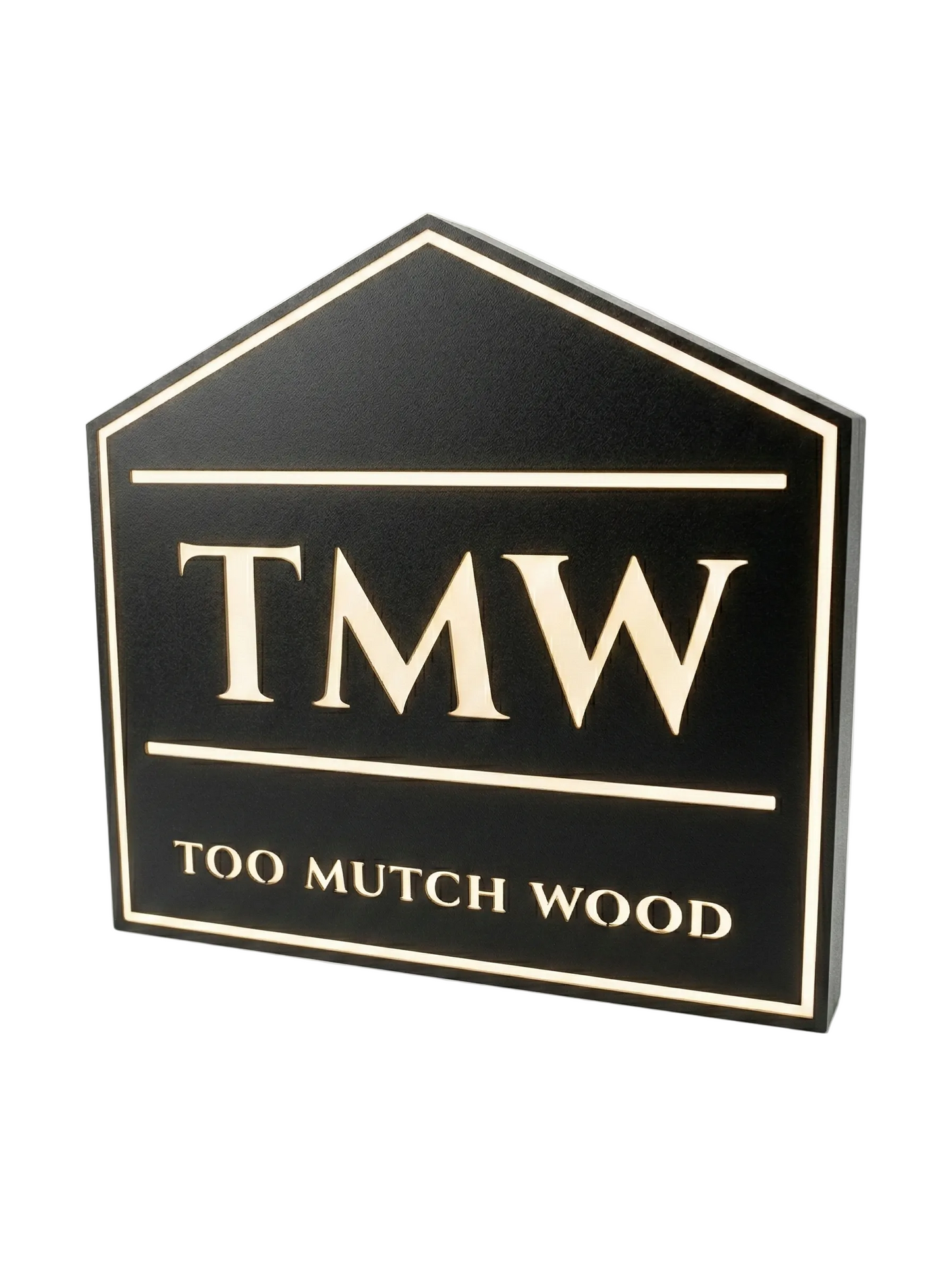 Black sign with 'TMW' and 'Too Much Wood' text on a white background